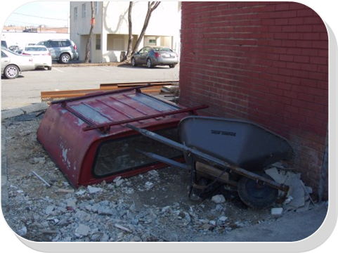 Car parts dumped behind a commercial building should be reported to OCC.  If you witness the actual dumping take place, call the police immediately and take down a license plate number.  Do not confront the offenders.   